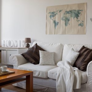 Image of comfortable white double sofa in day room